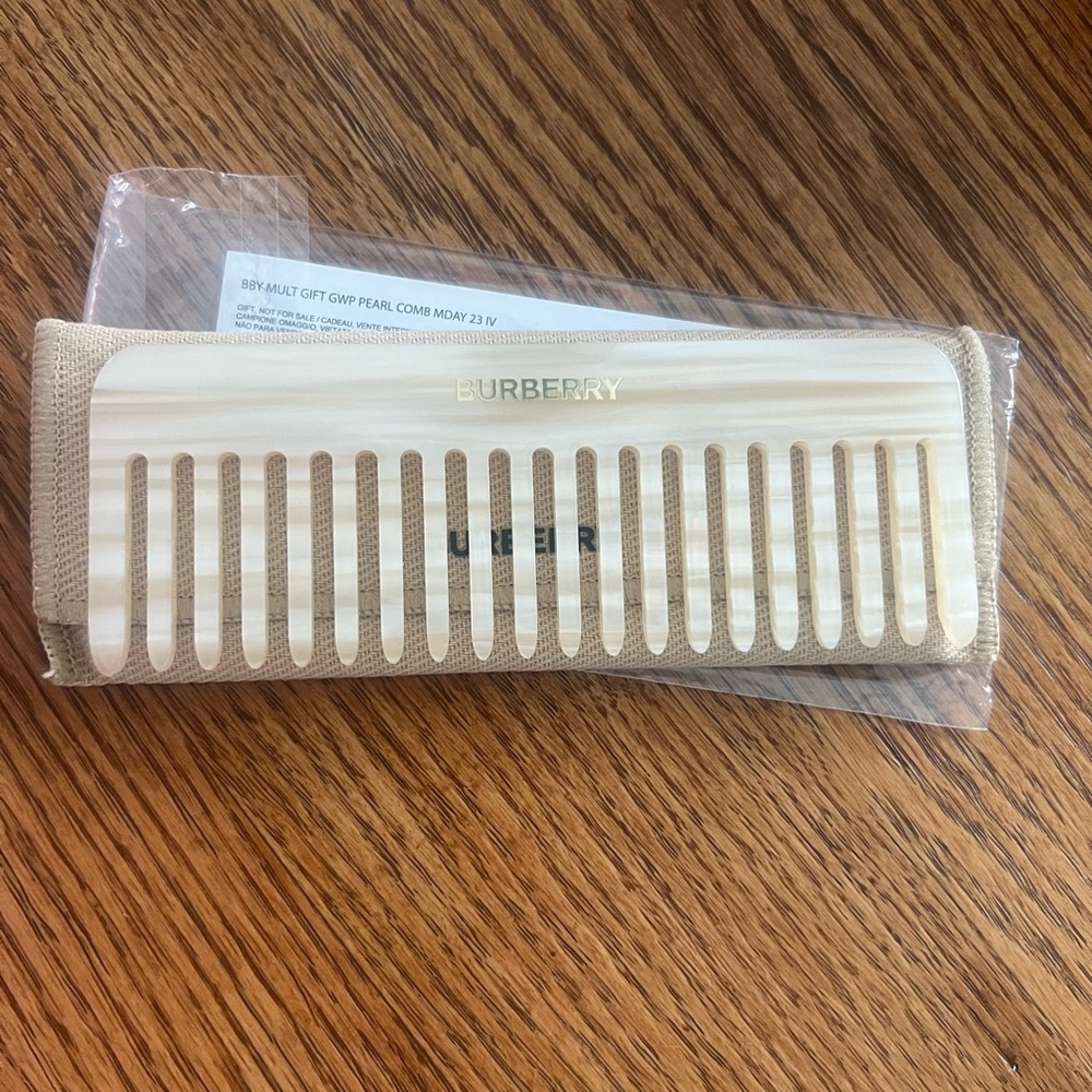 Limited edition Burberry pearl comb and case.